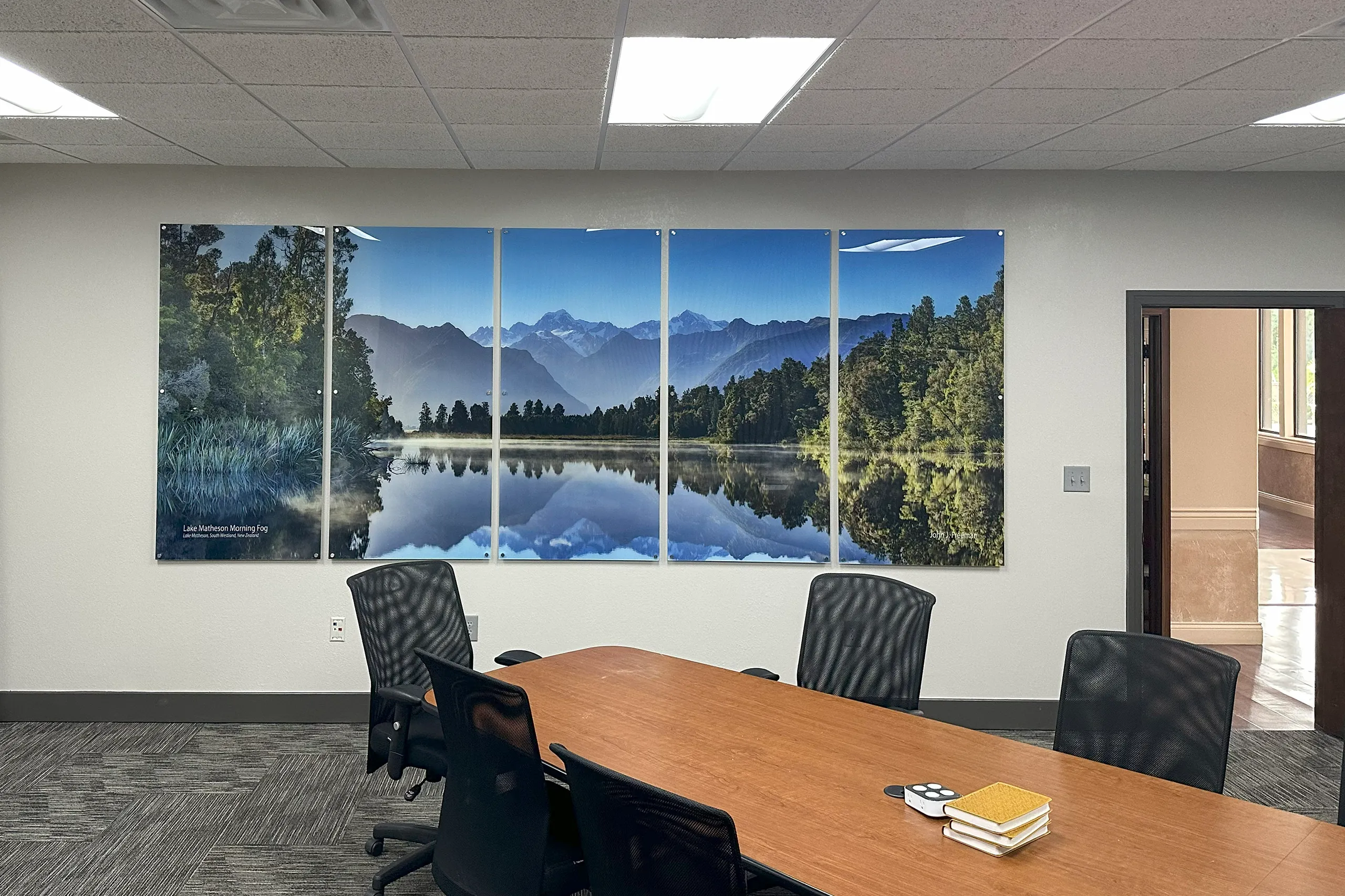 Lake Matheson panoramic wall art installed in a corporate conference room
